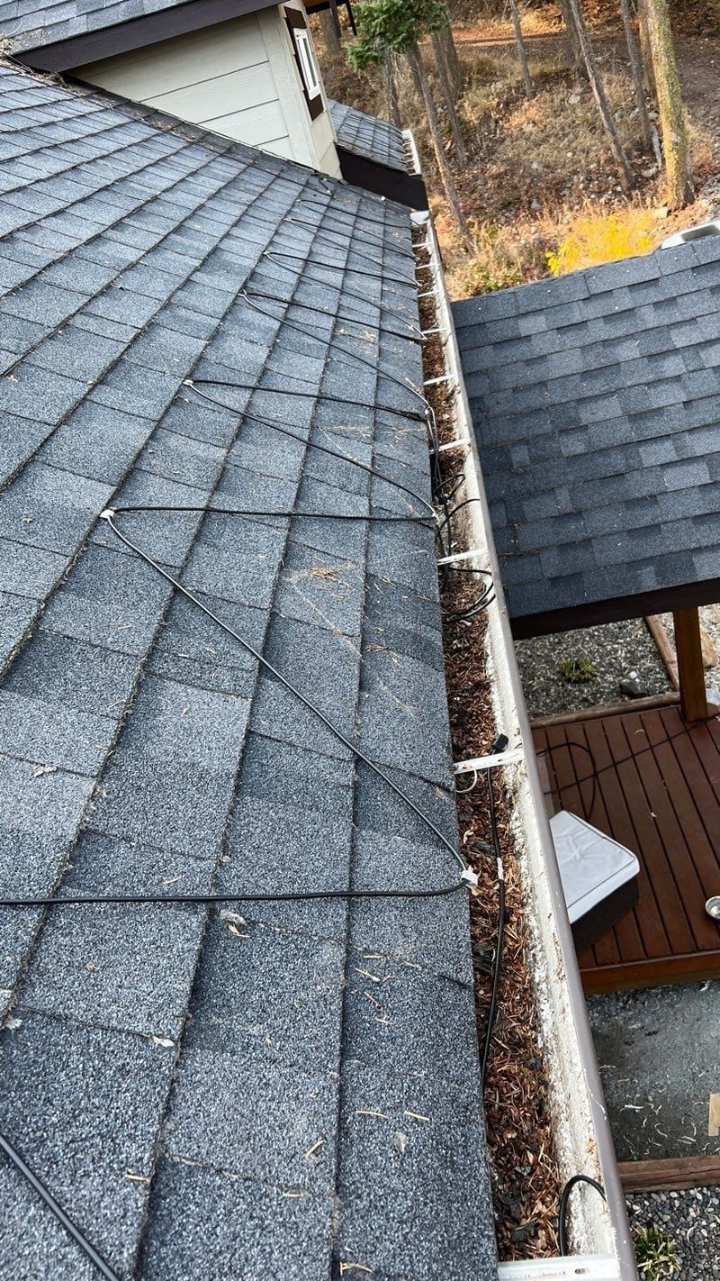Premium Roofing heat trace install on an Okanagan home, cable in the gutter and across the eave