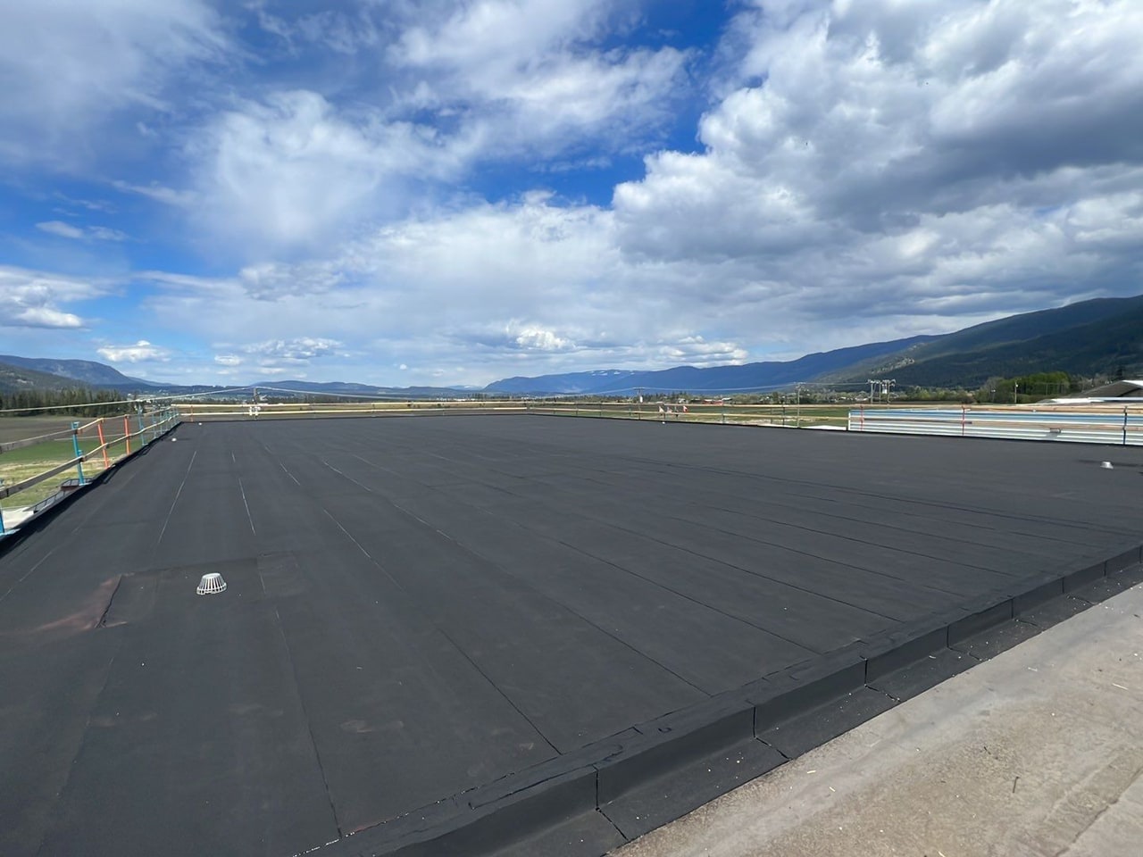 A large new two-ply SBS torch-on roof on an industrial building