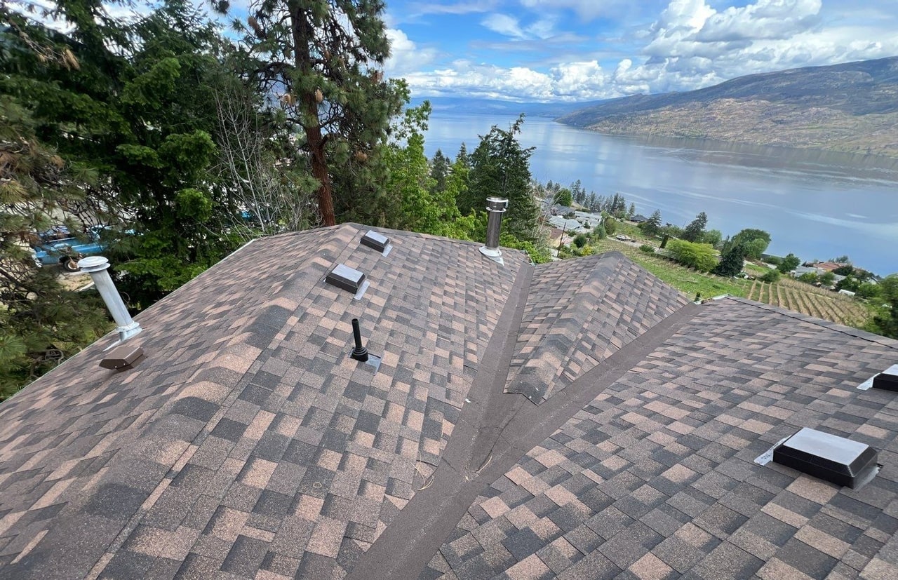 A new brown shingle roof, Okanagan Lake and the hills beyond